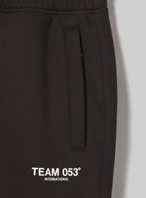 Heren Alcott bg1 beige donker joggingbroek met team 053 print kleding PT241164